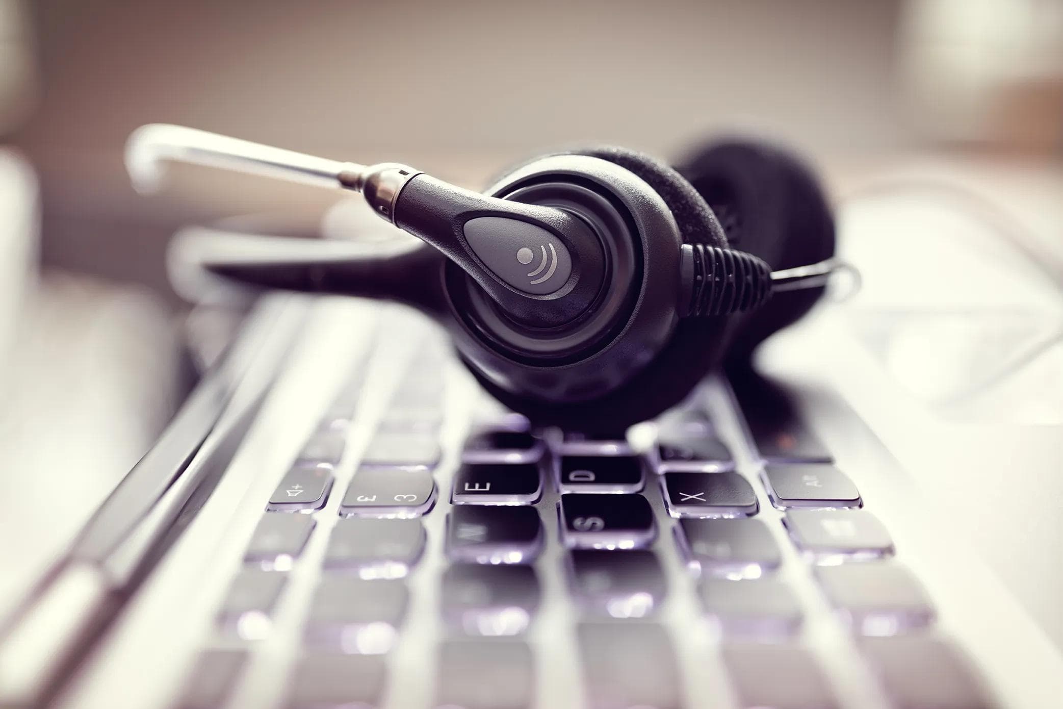Headset on top of a laptop keyboard